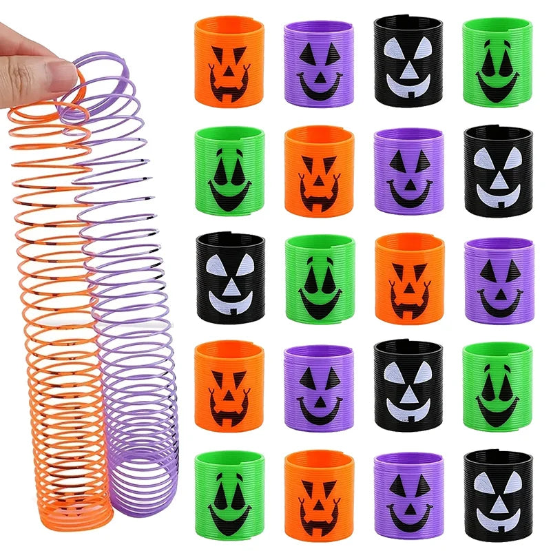 A set of Halloween pumpkin coil spring toys in various colors including orange, purple, green, and black.