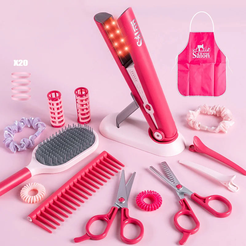 A pink kids' pretend play hair stylist beauty salon set featuring various styling tools like combs and scissors.