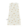 A cream colored sleeveless baby sleeping bag with a repeating pattern of small orange and blue animal figures.