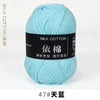 A ball of light blue milk cotton yarn labeled with Chinese characters and a number 47