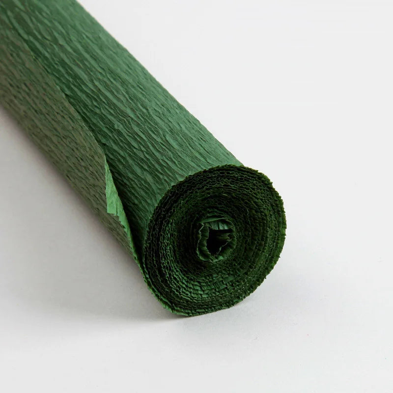 A roll of dark green crepe paper for DIY crafts and gift wrapping.