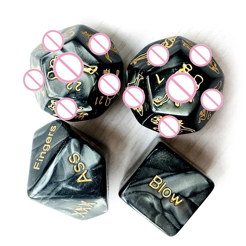 A set of black dice and a playful red metal table bell for couples' games