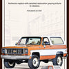 A detailed replica of a 1:24 scale Chevrolet K5 Blazer RC crawler in orange and white paint.