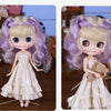 A Blyth 1/6 scale fashion doll with lavender hair and a white ruffled dress, shown in two poses.