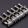 A set of titanium alloy electric guitar bridge saddles for ST models, shown in a close-up view.