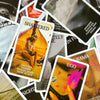 A close-up of various cards from a Mystic Black Rose Oracle Deck featuring themes like shattered, crushed sadness, and ego.