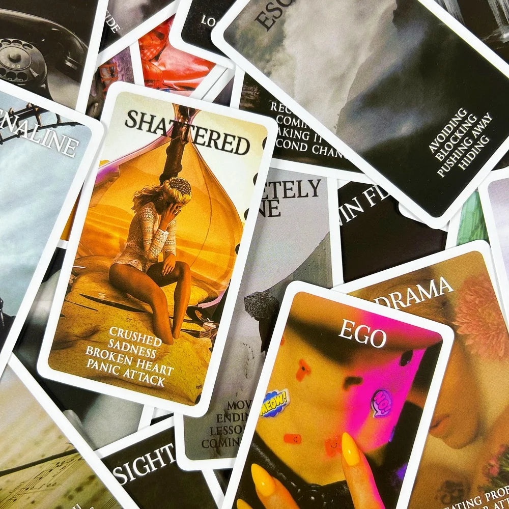 A close-up of various cards from a Mystic Black Rose Oracle Deck featuring illustrations and text.
