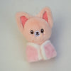 A fluffy pink cartoon animal plush toy with large ears and a light pink bag charm attached.