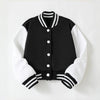 Black and white knitted cardigan with a striped collar and cuffs