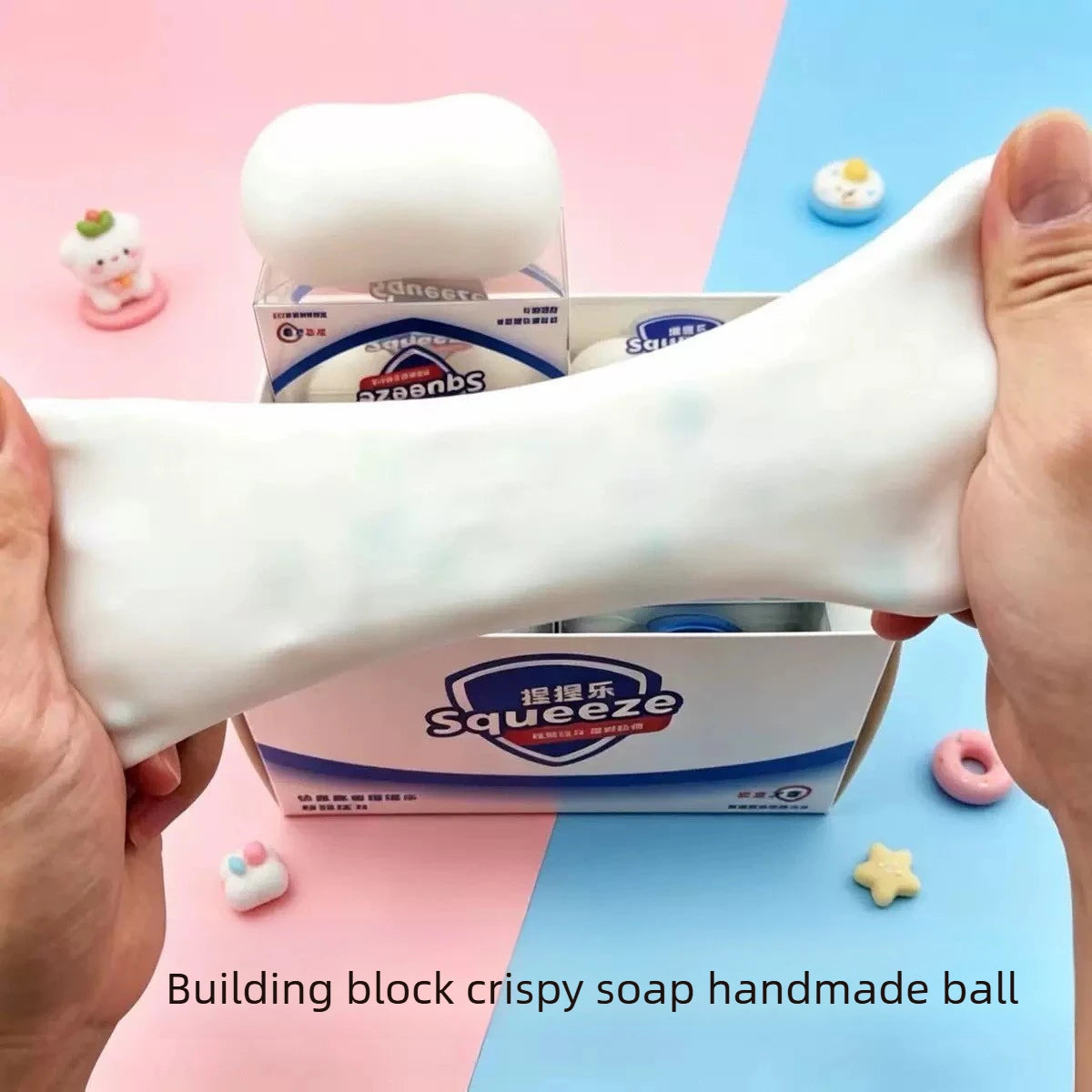 Handmade block soap is being squeezed to form a ball for a building block fidget toy