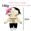 A plush doll resembling Eminem, XXXTentacion, and Frank Ocean with black and pink hair.