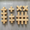 Wooden building blocks shaped like an X and a hash symbol for creative play