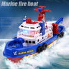 A red and blue electric marine rescue boat toy is shown speeding through the water with white spray.