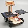 A wooden model kit of a solar-powered lunar rover featuring solar panels and wheels.