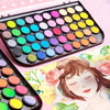 A portable watercolor paint set with brushes showing various colorful paint pots on a black tray.