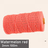 A skein of watermelon red 3mm cotton macrame cord, 100 meters long.