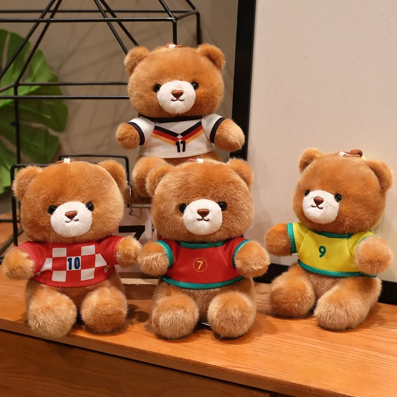 Three teddy bears wearing football jerseys, including one in red and white, another in red, and a yellow one.