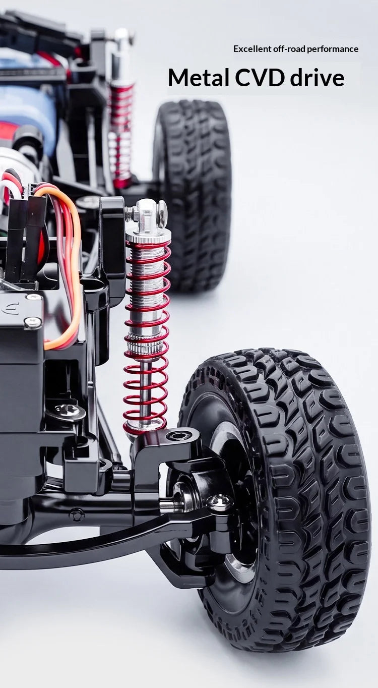 A close-up of a black metal CVD drive and tire assembly for an RC crawler truck.