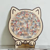 A wooden cat jigsaw puzzle featuring many small, colorful cats arranged in a circular pattern for home decor.