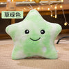 A soft, light green star-shaped plush pillow with a smiling face and a small button detail.