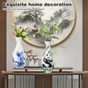 Blue and white porcelain flower vase with bamboo plant and panda figurine on a wooden shelf