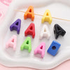 A set of colorful acrylic letter beads shaped like the letter A in various colors and sizes.