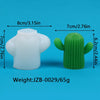 A white silicone mold shaped like a cactus and a green silicone mold shaped like a cactus.