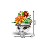 A set of gothic floral skull building blocks featuring orange and yellow flowers on a white stone skull base.