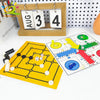 A magnetic tabletop game set featuring a yellow board, black magnetic pieces, and dice on a white surface.