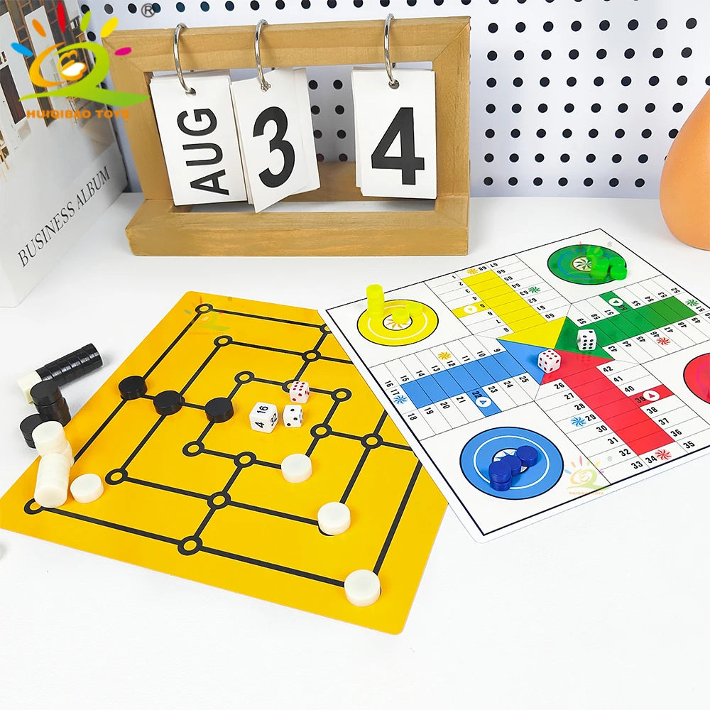 A magnetic tabletop game set featuring a yellow board, black magnetic pieces, and dice on a white surface.