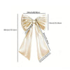 Creamy white satin bow decoration for parties and walls, shown with various size measurements.