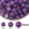 A close-up view of small purple resin spacer beads with a starry sky effect, shown in various sizes.