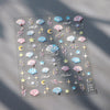 A sheet of 5D bronzing gothic nail art stickers featuring seashells, stars, and celestial elements.