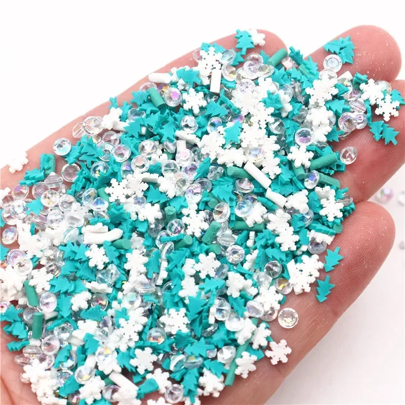 A hand holds a pile of iridescent polymer clay slices in shades of teal and white for DIY crafts.