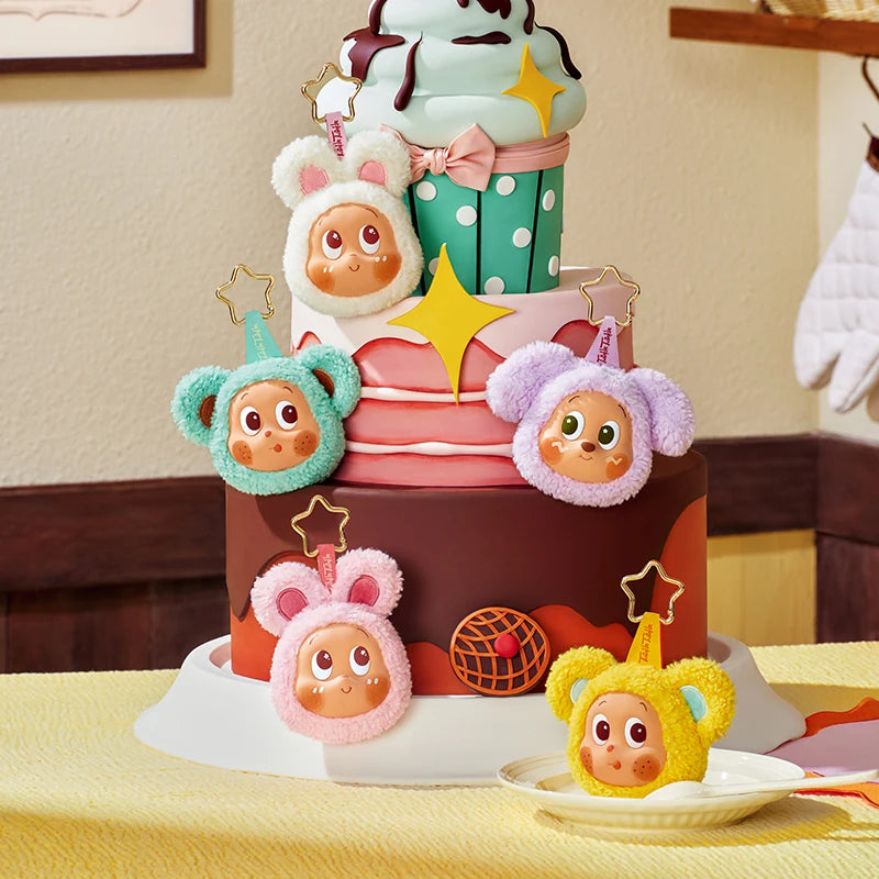 A tiered cake decorated with adorable animal-themed toppers resembling earbud case covers.