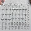 A collection of vintage antique silver cross charms and pendants for jewelry making