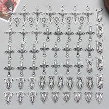 A collection of vintage antique silver cross charms and pendants for jewelry making