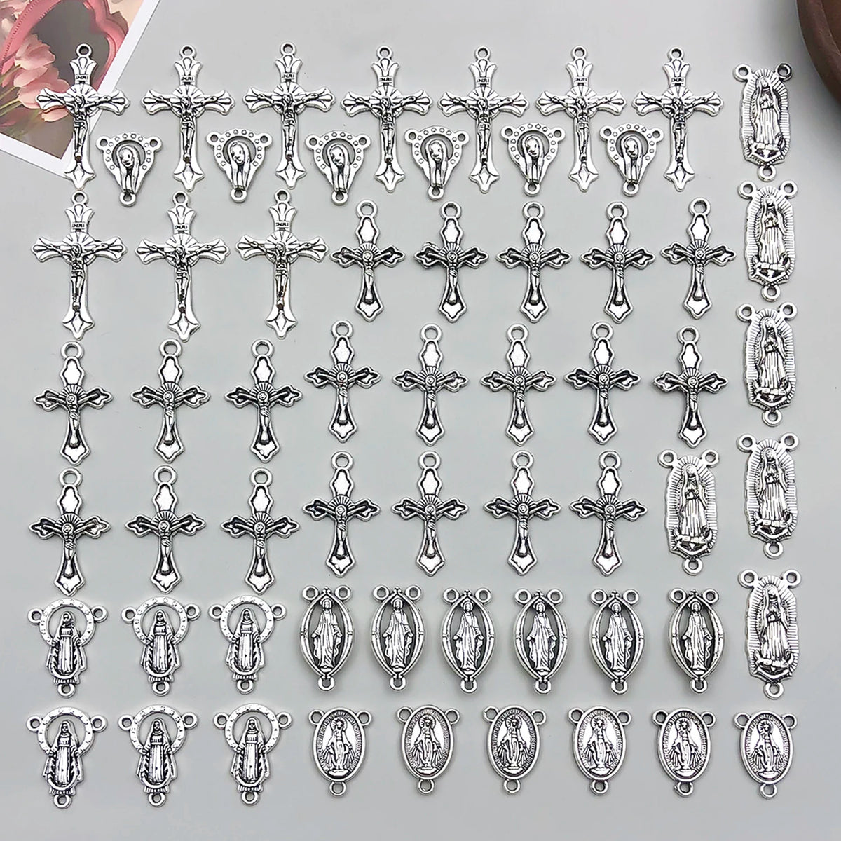 A collection of vintage antique silver cross charms and pendants for jewelry making
