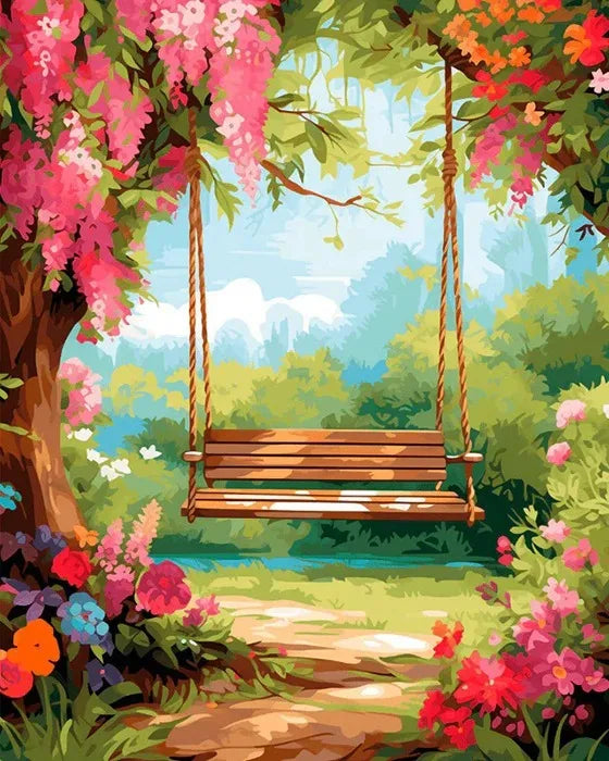 A wooden swing hangs from a tree branch in a lush garden with pink and orange blossoms and a path leading to a calm body of w
