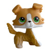 A small, tan and white Bobbing Deer bobblehead toy with large green glow eyes.