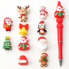 A collection of silicone beads featuring Christmas characters like Santa, reindeer, and a tree.