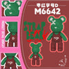 A close-up view of a green bear mini building block set with a brown strap and a pink background.
