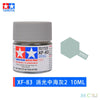 A glass jar of XF-83 medium sea gray acrylic paint, labeled for model kits and miniatures.