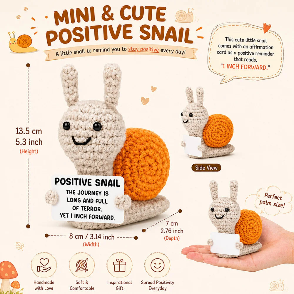 A handmade crochet positive snail toy with an affirmation card, showing side view and dimensions.