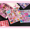 A colorful die-cut sticker pack featuring hearts, stars, and various cute designs on pink and purple backgrounds.