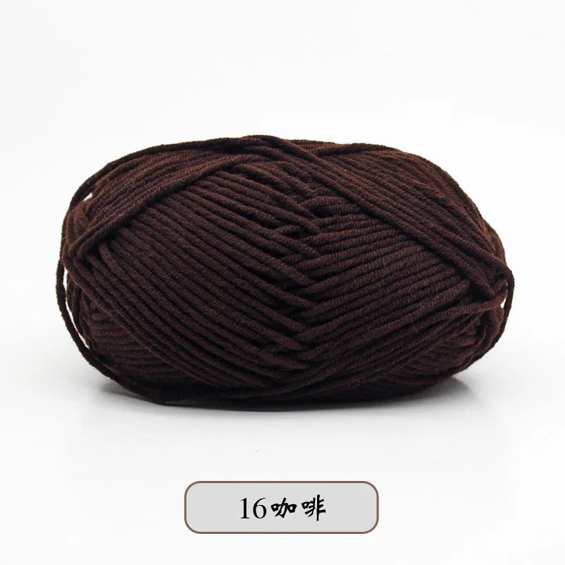 A ball of dark brown pre-dyed milk cotton yarn used for knitting and crochet.