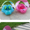 Pink and blue inflatable baby seat ring with sunshade canopy displayed outdoors on a paved surface.