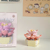 A pink miniature flower bouquet built from interlocking plastic blocks.