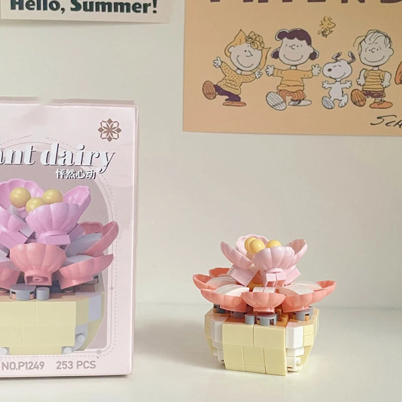 A pink miniature flower bouquet built from interlocking plastic blocks.