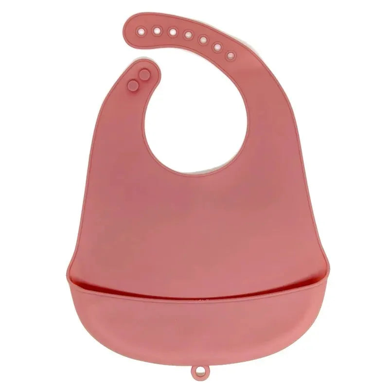A pink waterproof silicone baby bib with a catch pocket.